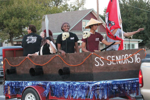 Members of the Class of 2016 at Wylie High School man their cannon in the homecoming parade held downtown Monday evening.