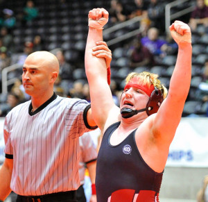 Bloody but unbowed, the Pirates’ Ryan Beattie gets his hand raised in victory after defeating Amarillo Palo Duro’s Samuel Pedraza in the 220-pound state final last Saturday at Garland’s Culwell Center. Beattie, a junior, is the first Wylie ISD wrestler to win a state championship.