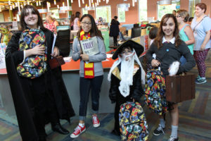 Winners of the Harry Potter Birthday costume contest at Smith Public Library were, from left, Kimber Cato (Severus Snape), Breana Do (Gryffindor student), Esa Rahim (Albus Dumbledore) and Alexa Houle (Hermione Granger).