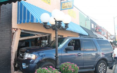 Vehicle crashes into downtown business
