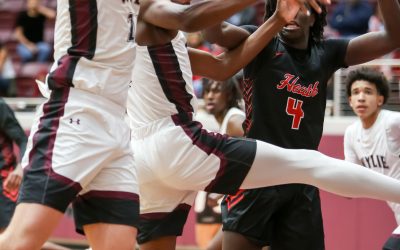 Wylie boys win first game; girls fall short