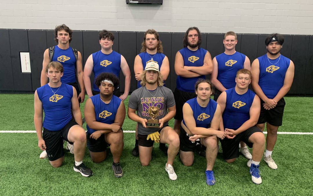 Community builds on strength at line of scrimmage