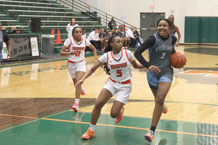 Lady Raiders smother Naaman Forest to open district