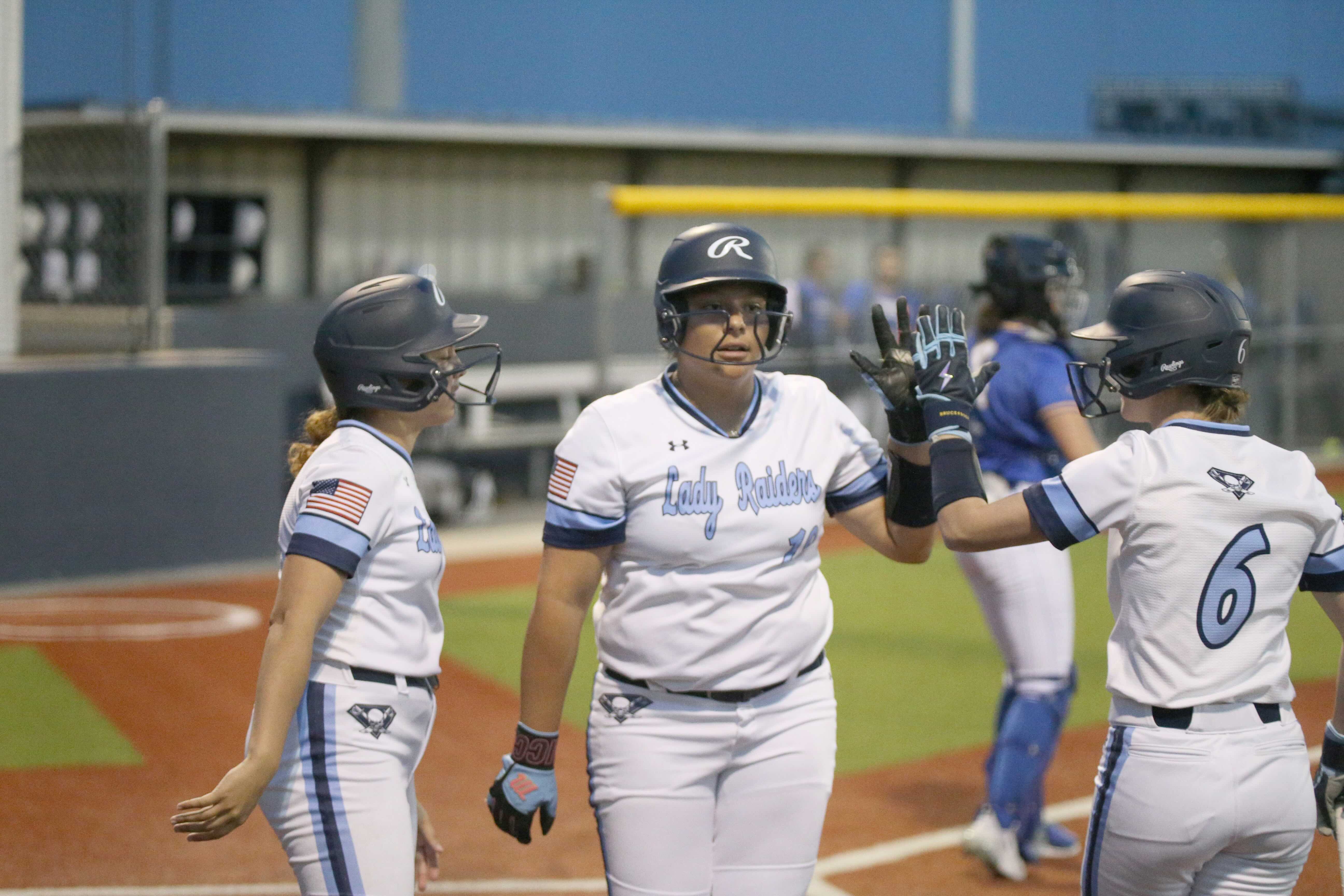 Softball teams dominate district openers